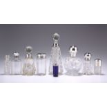 A GROUP OF SIX SILVER-MOUNTED GLASS SCENT BOTTLES AND FLASKS