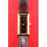 A LADY'S GOLD-PLATED HAMILTON STRAP WATCH