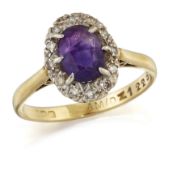 AN 18 CARAT GOLD AMETHYST AND DIAMOND CLUSTER RING