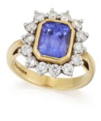 AN 18 CARAT GOLD TANZANITE AND DIAMOND CLUSTER RING