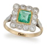 AN EMERALD AND DIAMOND CLUSTER RING