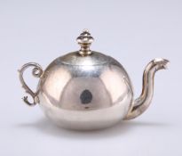 A SILVER MINIATURE TEAPOT