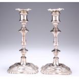 A PAIR OF GEORGE V SILVER CANDLESTICKS