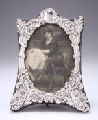 AN ART NOUVEAU SILVER-MOUNTED PHOTOGRAPH FRAME