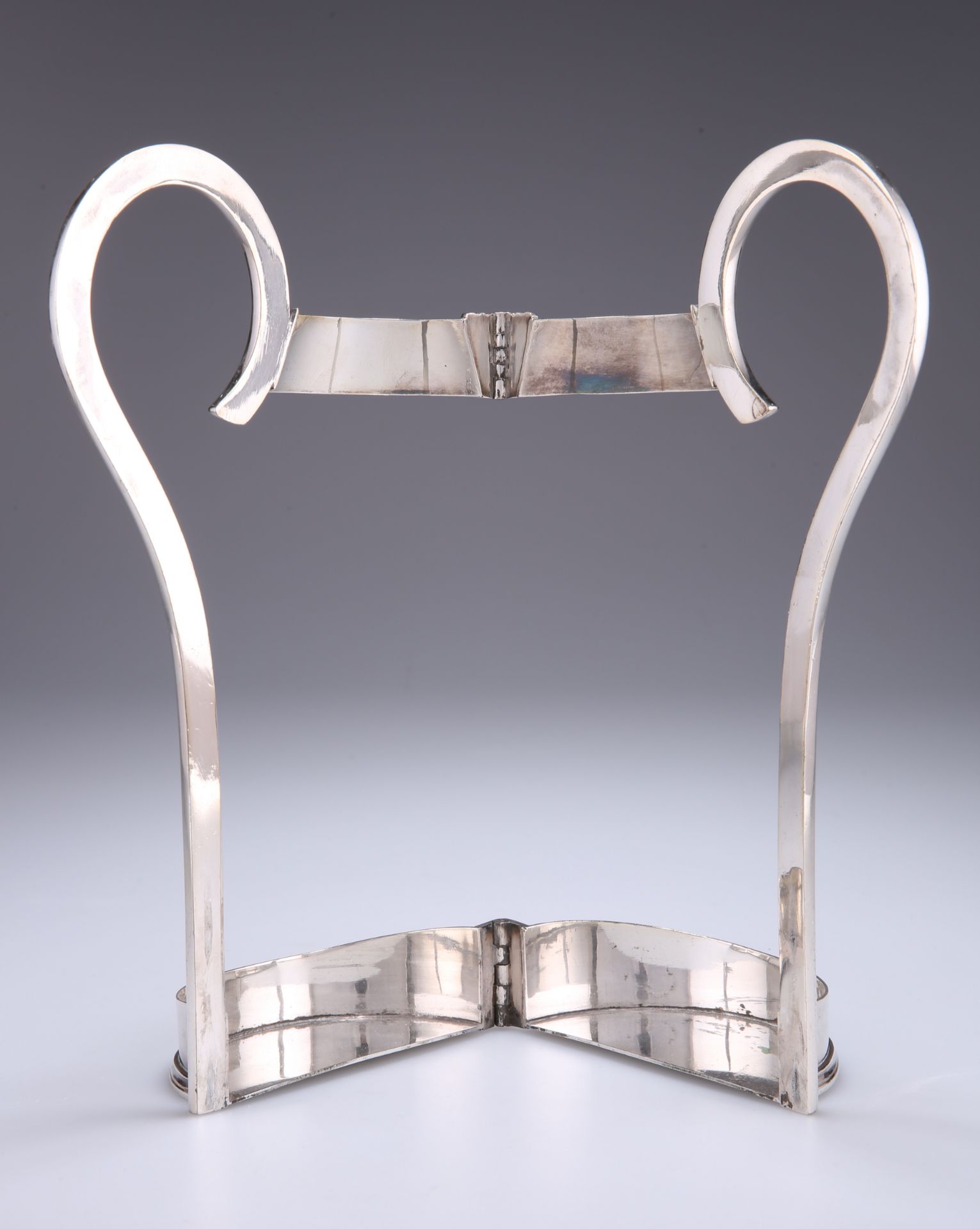 A 19TH CENTURY SILVER-PLATED BOTTLE HOLDER