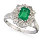 AN EMERALD AND DIAMOND CLUSTER RING