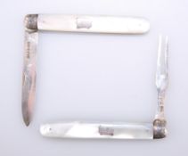 A VICTORIAN SILVER AND MOTHER-OF-PEARL FOLDING FRUIT KNIFE AND FORK