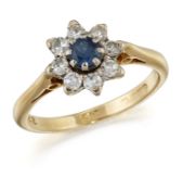 AN 18 CARAT GOLD SAPPHIRE AND DIAMOND CLUSTER RING