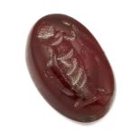 A LOOSE OVAL CARNELIAN INTAGLIO