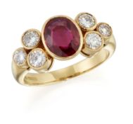 AN 18 CARAT GOLD RUBY AND DIAMOND RING