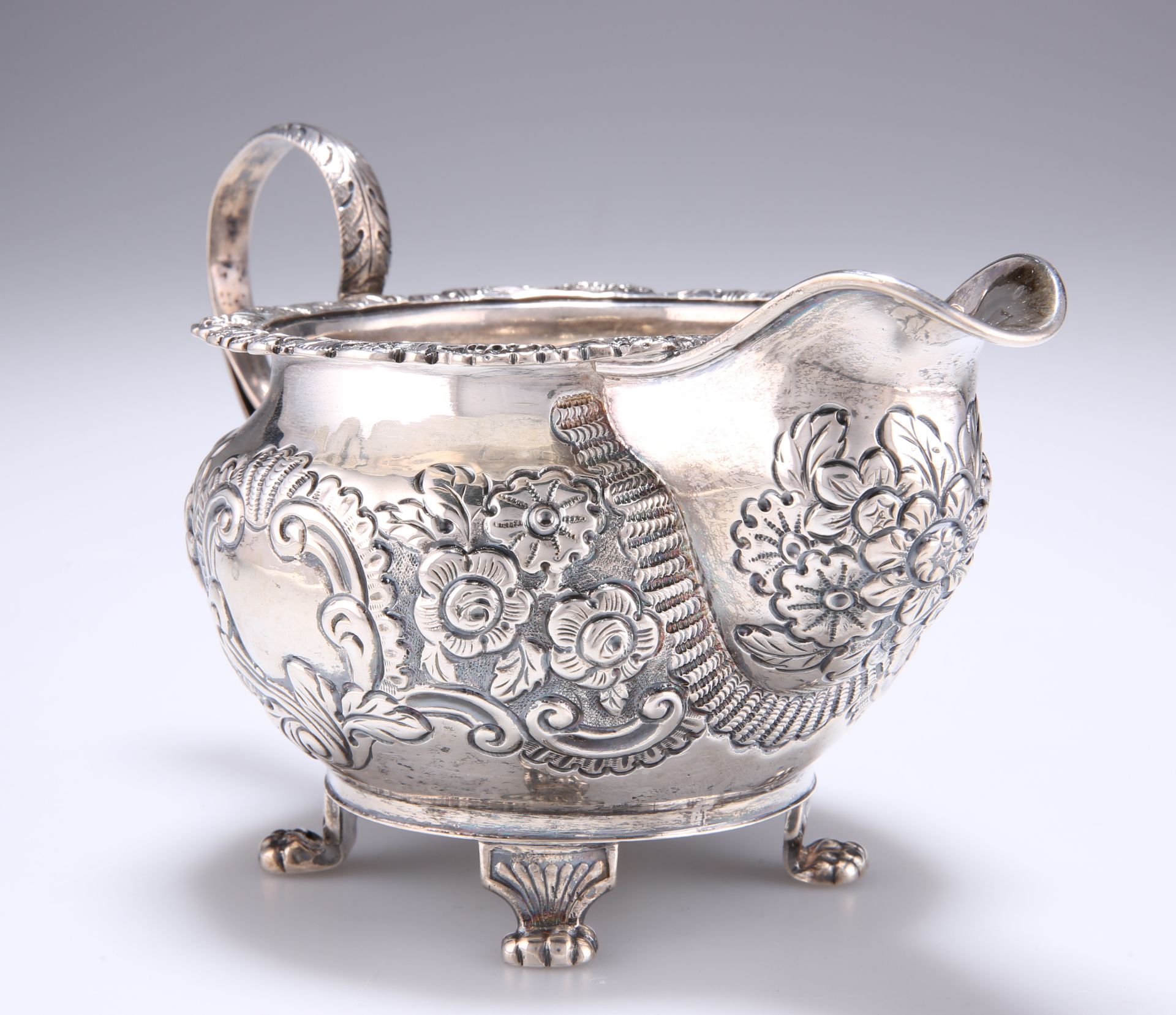 A GEORGE IV IRISH SILVER CREAM JUG