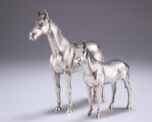 A PAIR OF ELIZABETH II CAST SILVER MODELS OF HORSES