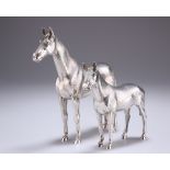 A PAIR OF ELIZABETH II CAST SILVER MODELS OF HORSES