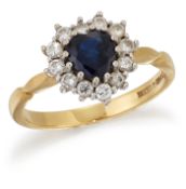 AN 18 CARAT GOLD SAPPHIRE AND DIAMOND CLUSTER RING