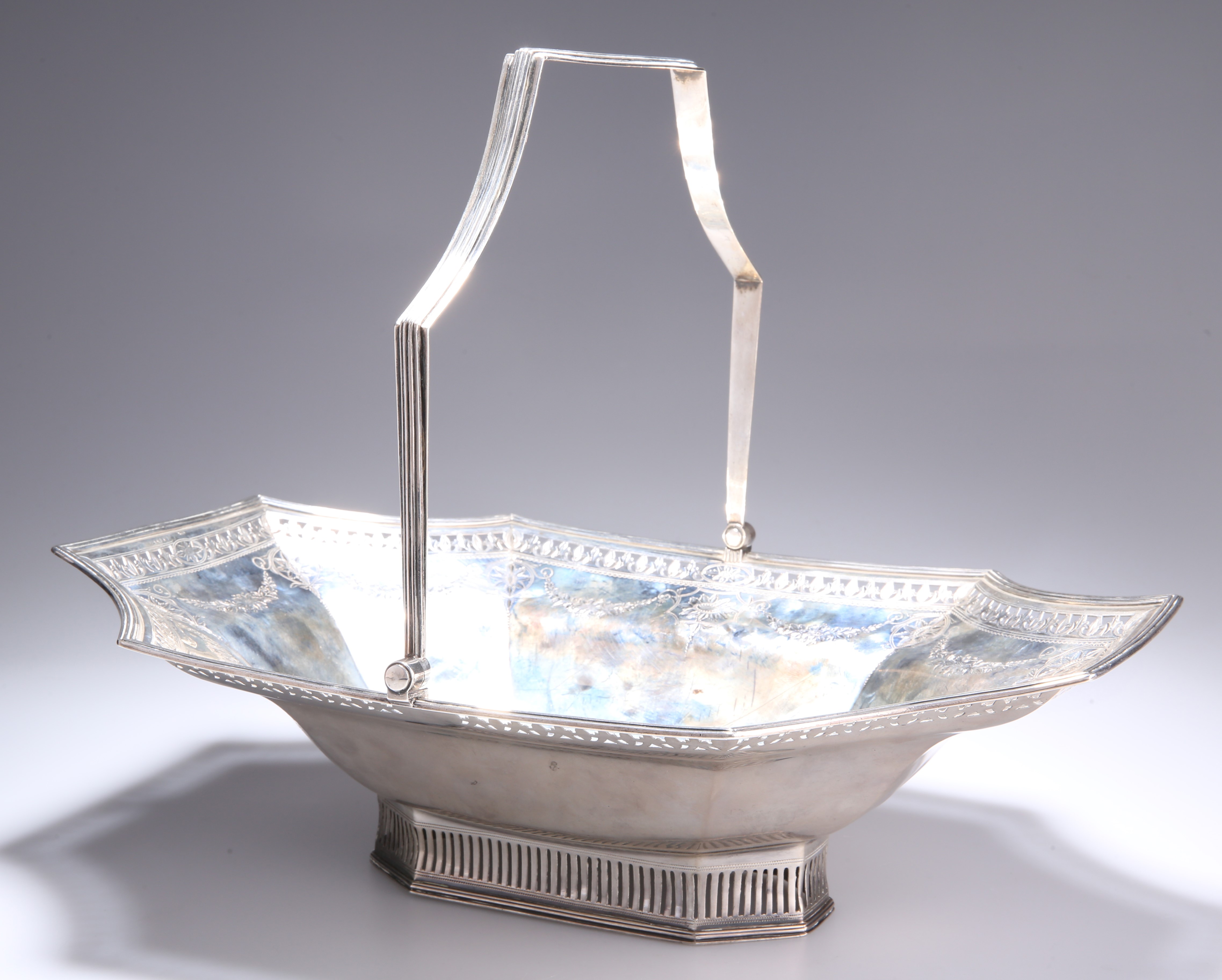 A GEORGE III SILVER CAKE BASKET