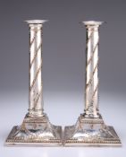 A PAIR OF OLD SHEFFIELD PLATE CANDLESTICKS