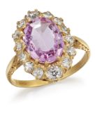 A PINK TOPAZ AND DIAMOND CLUSTER RING