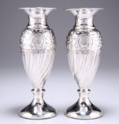 A PAIR OF SILVER VASES