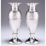 A PAIR OF SILVER VASES