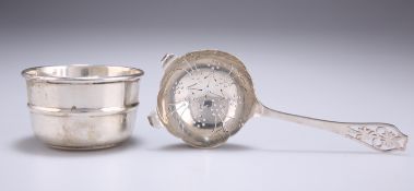 AN ELIZABETH II SILVER TEA STRAINER ON STAND