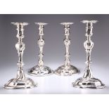 A SET OF FOUR GEORGE II CAST SILVER CANDLESTICKS