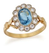 A BLUE TOPAZ AND DIAMOND CLUSTER RING