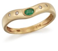 AN 18 CARAT GOLD EMERALD AND DIAMOND RING