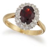 A GARNET AND DIAMOND CLUSTER RING