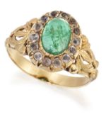 AN EMERALD AND PASTE CLUSTER RING