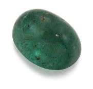 AN OVAL CABOCHON EMERALD