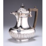 A LATE VICTORIAN SILVER HOT WATER JUG