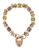 AN EARLY 20TH CENTURY AMETHYST AND PERIDOT BRACELET