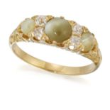 A CAT'S EYE CHRYSOBERYL AND DIAMOND RING