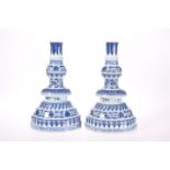 A PAIR OF CHINESE MING STYLE BLUE AND WHITE CANDLESTICKS