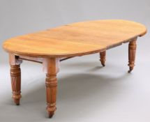 A VICTORIAN OAK WIND-OUT EXTENDING DINING TABLE