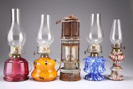 FOUR GLASS BASE OIL LAMPS