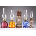 FOUR GLASS BASE OIL LAMPS