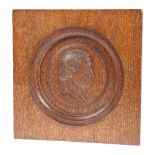 A LATE 19TH CENTURY CARVED OAK PLAQUE