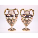 A PAIR OF LATE 19TH CENTURY DAVENPORT PORCELAIN TWIN HANDLED VASES