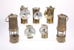 A GROUP OF BRASS LAMPS