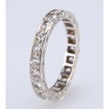 A WHITE SYNTHETIC SPINEL ETERNITY RING