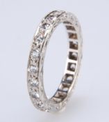 A WHITE SYNTHETIC SPINEL ETERNITY RING