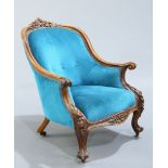 A VICTORIAN WALNUT AND UPHOLSTERED ARMCHAIR