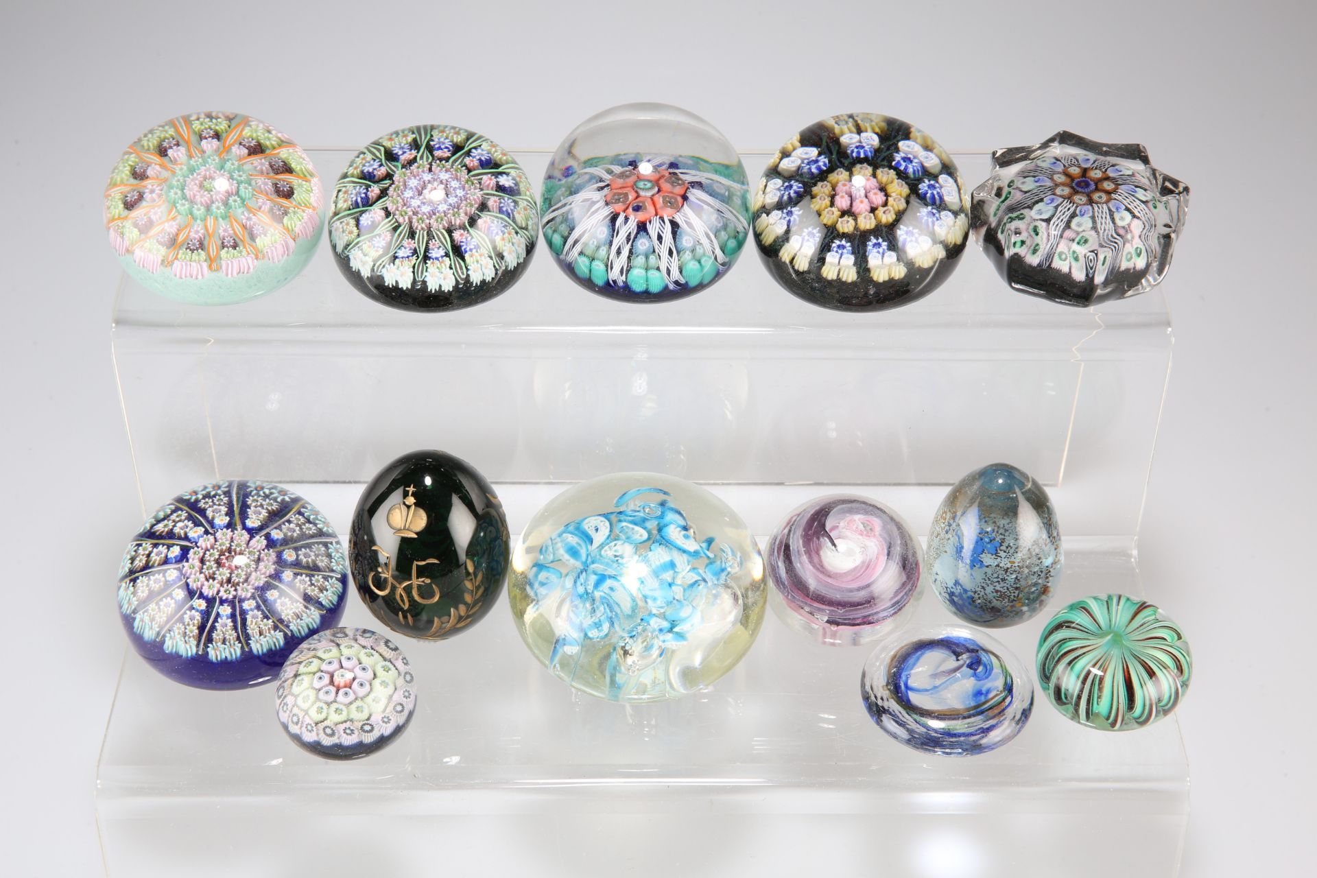 A GROUP OF GLASS PAPERWEIGHTS