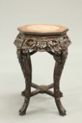 A CHINESE MARBLE INSET HARDWOOD JARDINIERE STAND, CIRCA 1900