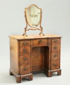 A GEORGIAN STYLE WALNUT KNEEHOLE DRESSING TABLE