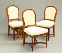 THREE MAHOGANY AND UPHOLSTERED CHAIRS FROM THE DINING SALOON OF R.M.S. MAJESTIC