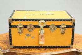 A VINTAGE TWO-HANDLED TRAVELLING TRUNK