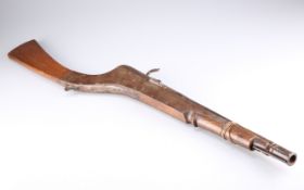 A PRIMITIVE SHORT MATCHLOCK GUN OF EASTERN ORIGIN