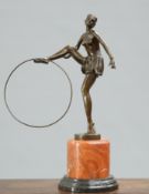 AN ART DECO STYLE BRONZE FIGURE OF A HOOP GIRL